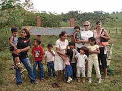 Volunteers with children in Galapagos.
